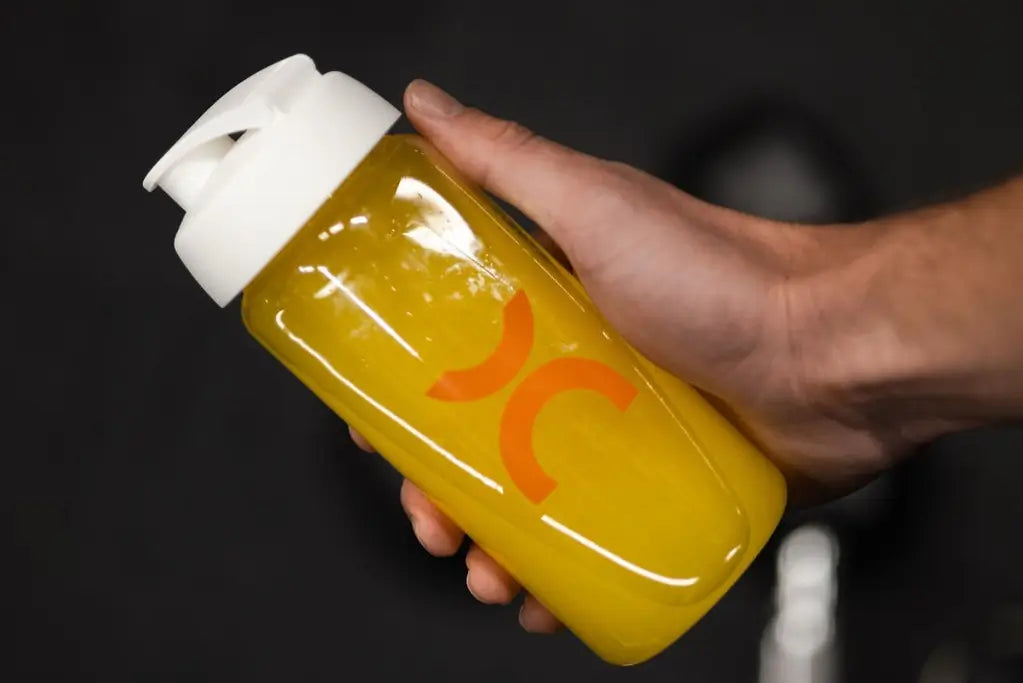 A shaker bottle with MOVE Orange & Mango flavor